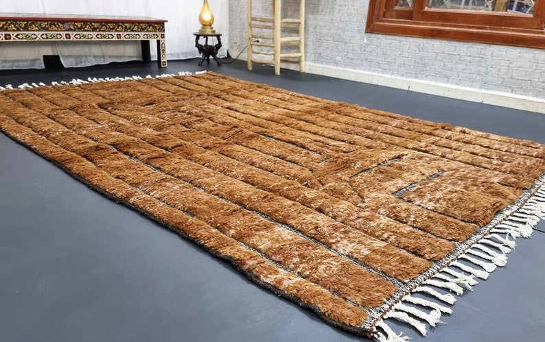 Custom Moroccan rug runner with brown base and gray striped Berber Moroccan rug design, handwoven from wool, featuring fringed edges for a chic Moroccan rug area.