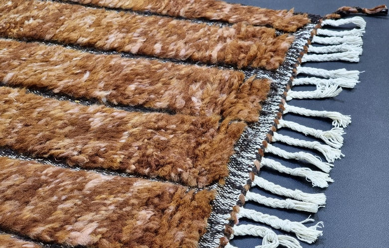 Detail of accent grid pattern on custom handmade wool rug
