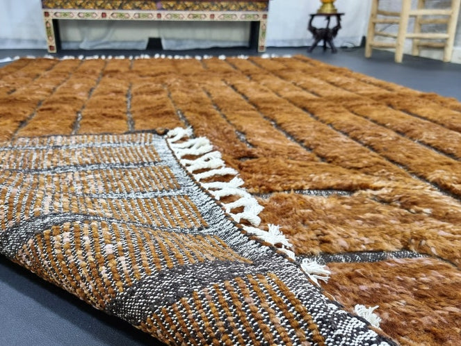Detail of accent grid pattern on custom handmade wool rug