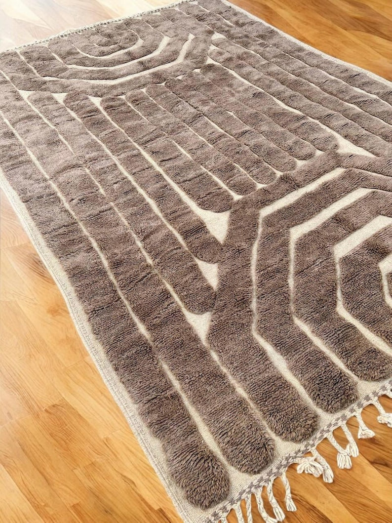 Custom Moroccan rug runner with cream base and black geometric lattice Berber Moroccan rug design, handwoven from wool, featuring fringed edges for a bold Moroccan rug area.