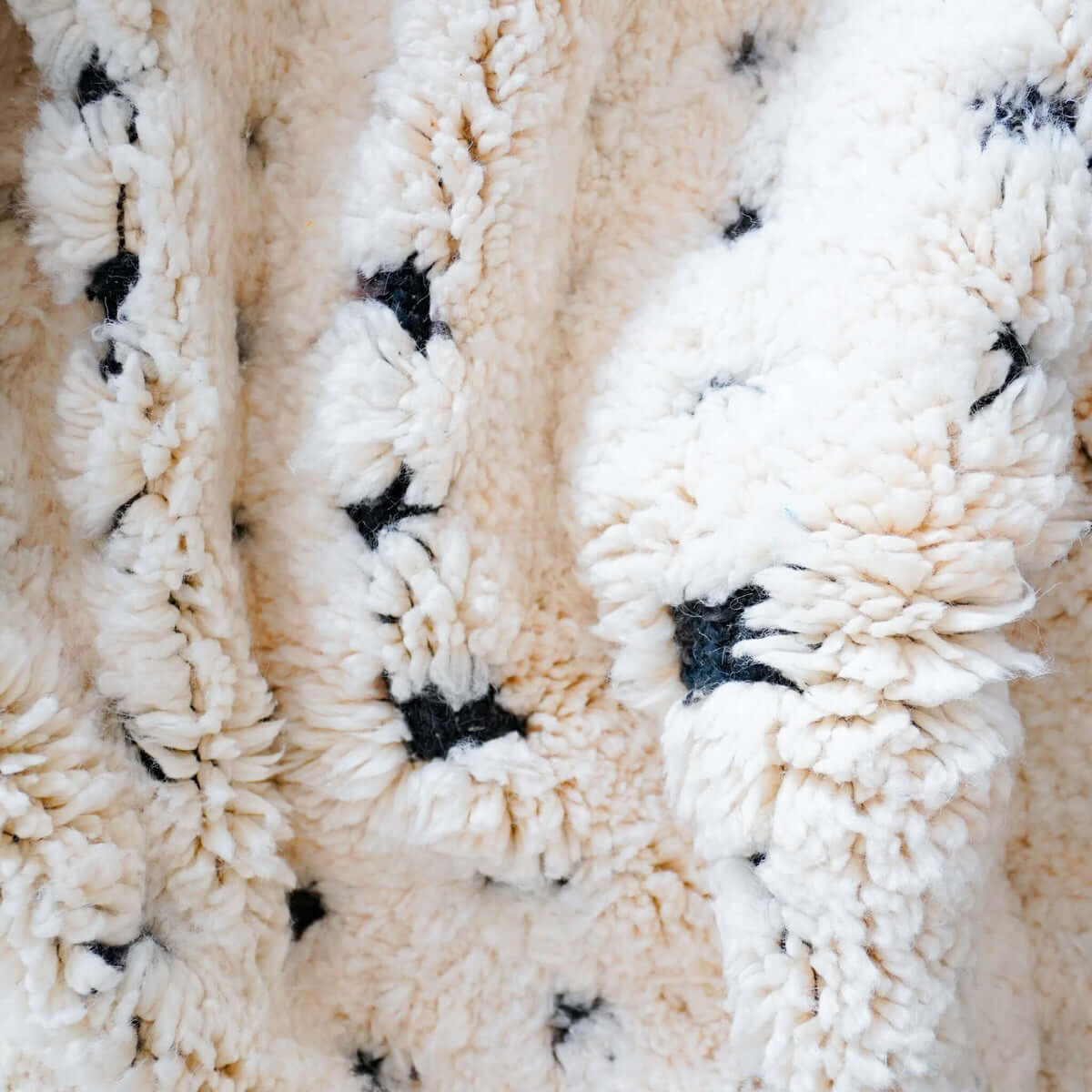 Detailed close-up of Atlasknot rug showing dense wool texture and intricate Berber knot motifs