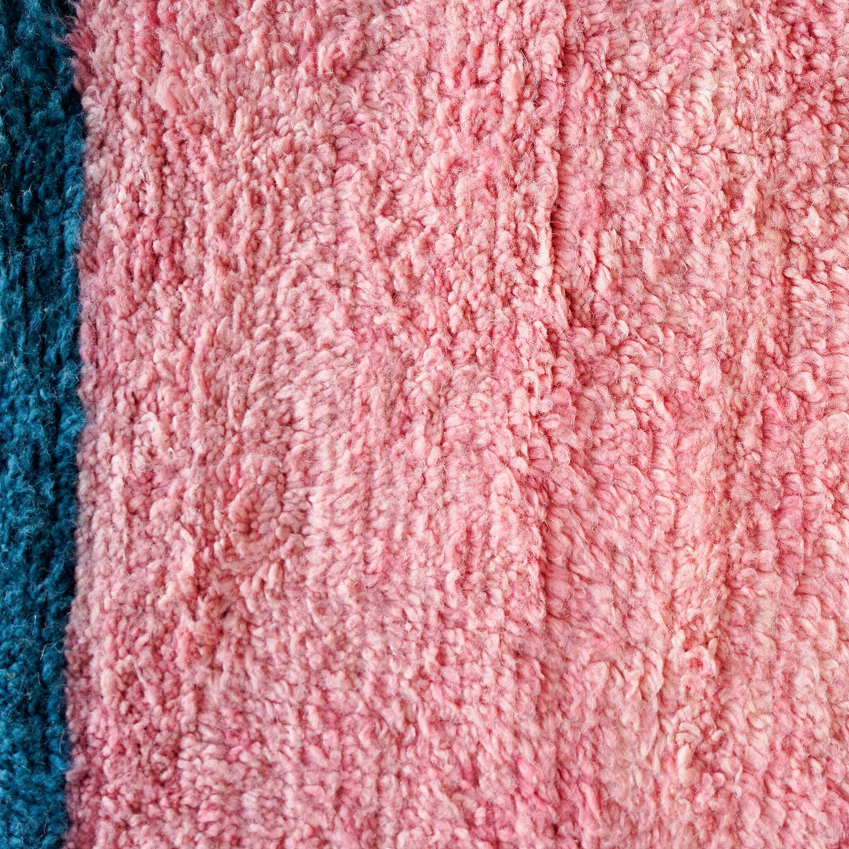 Detailed view of Vibraber rug showing bright colors and intricate Berber wool knotting