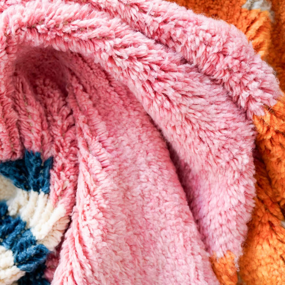 Detailed view of Vibraber rug showing bright colors and intricate Berber wool knotting