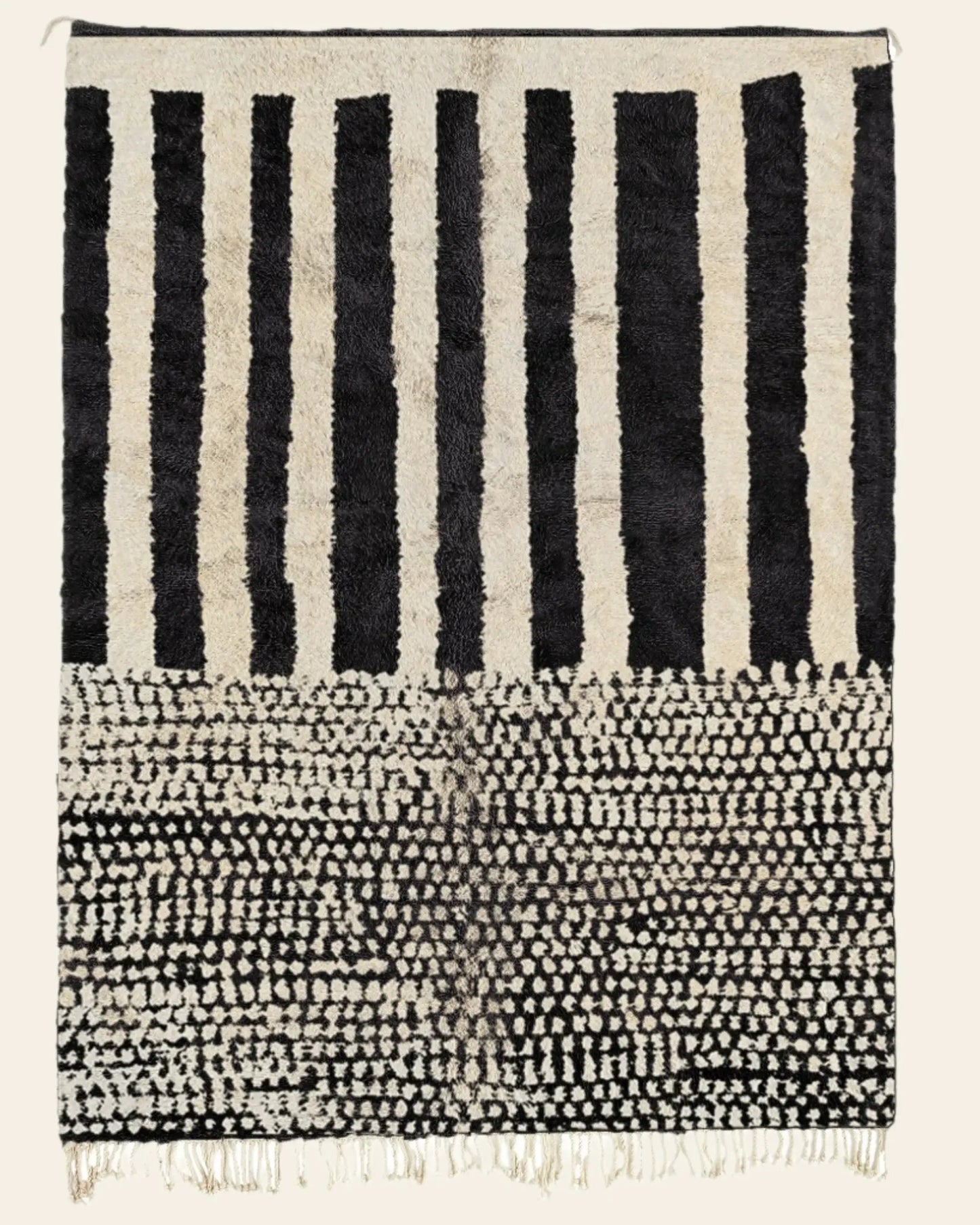 Custom Moroccan rug runner with black and white striped and dotted Berber Moroccan rug design, handwoven from wool, featuring fringed edges for a stylish Moroccan rug area.