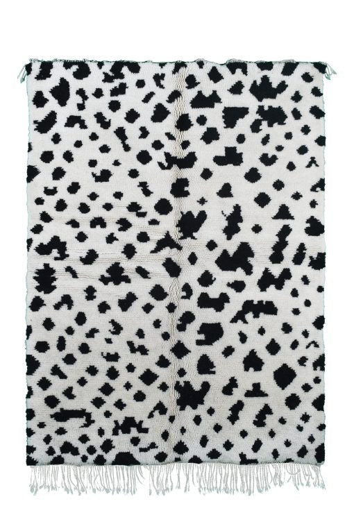 Custom Moroccan rug runner with white base and scattered black abstract Berber Moroccan rug design, handwoven from wool, featuring fringed edges for a unique Moroccan rug area.