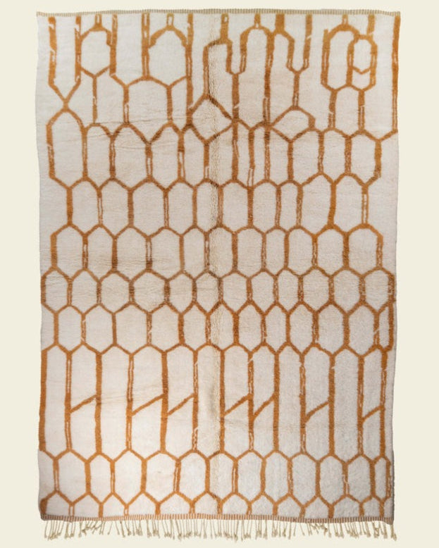 Custom Moroccan rug runner with cream base and orange hexagonal Berber Moroccan rug design, handwoven from wool, featuring fringed edges for a chic Moroccan rug area.