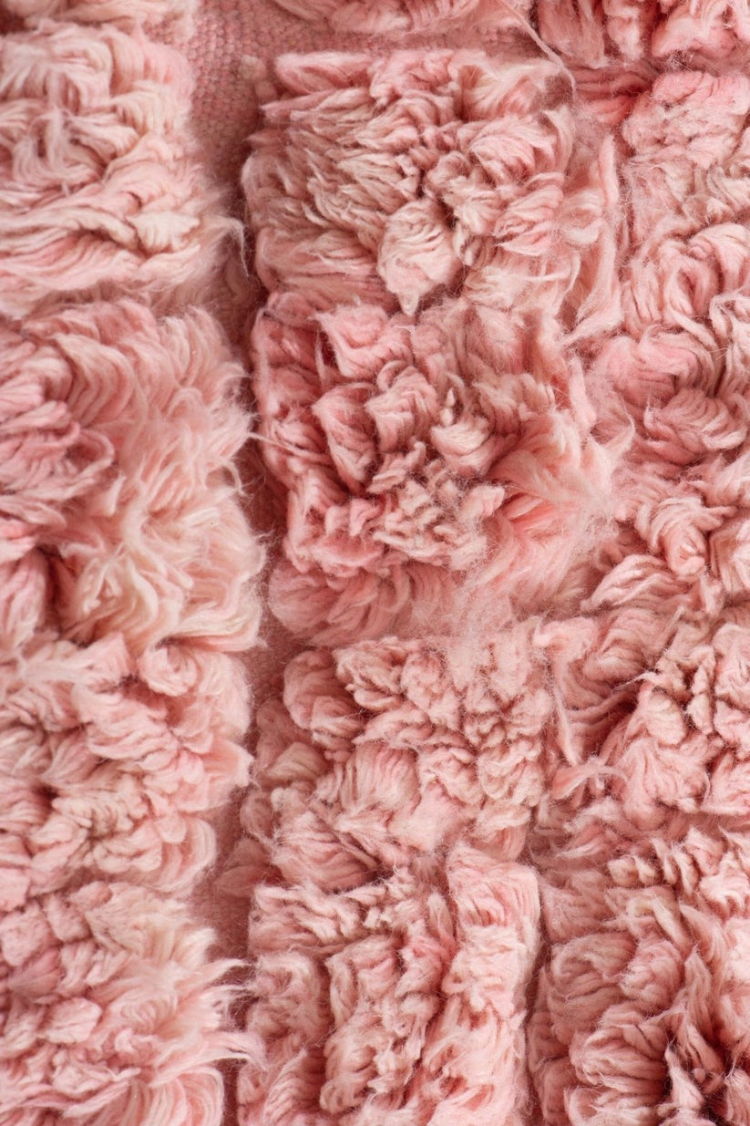 Custom Moroccan rug runner with pink and beige textured Berber Moroccan rug design, handwoven from wool, featuring fringed edges for a cozy Moroccan rug area.
