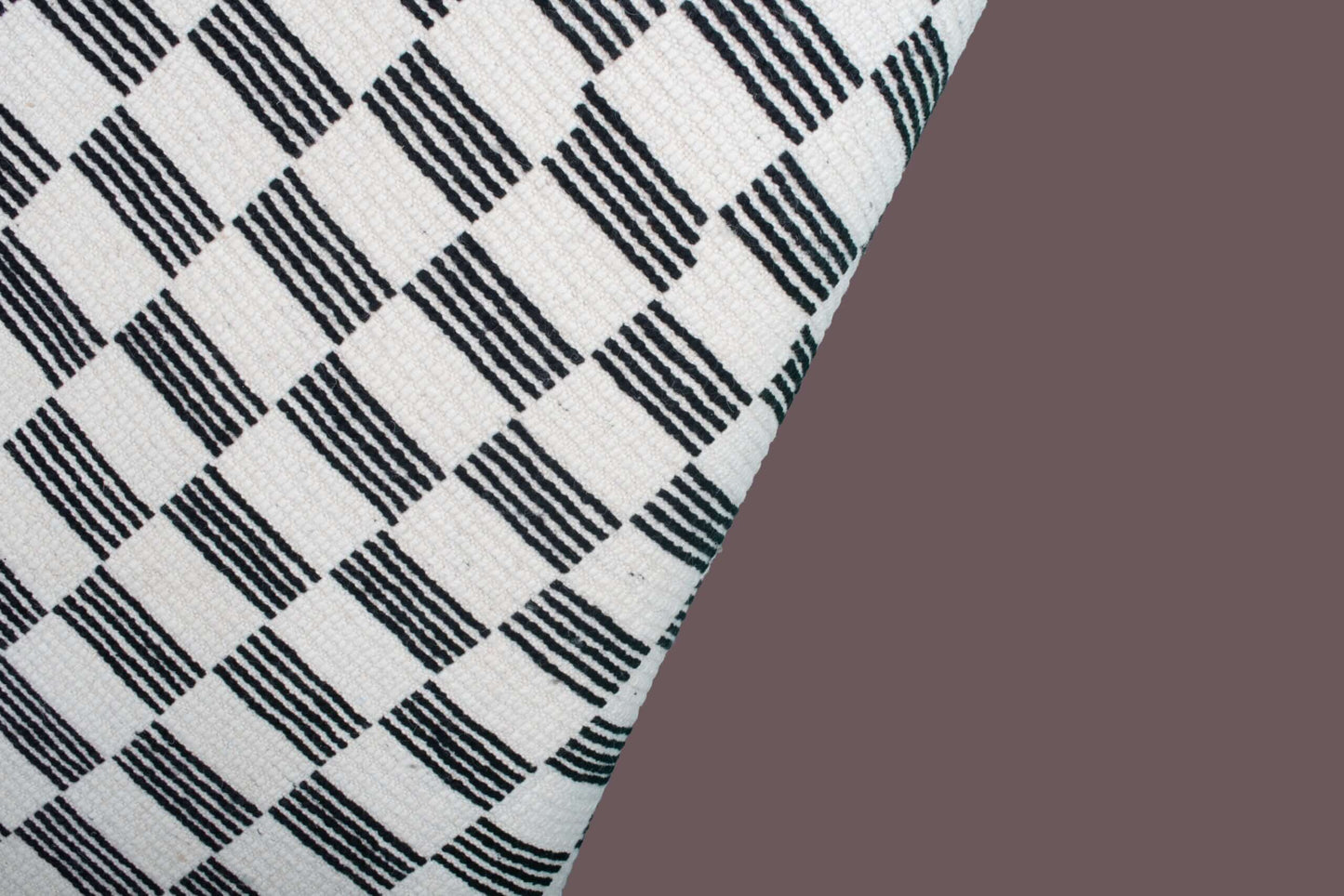 Custom Moroccan rug runner with black and white checkered Berber Moroccan rug design, handwoven from wool, featuring fringed edges for a striking Moroccan rug area.