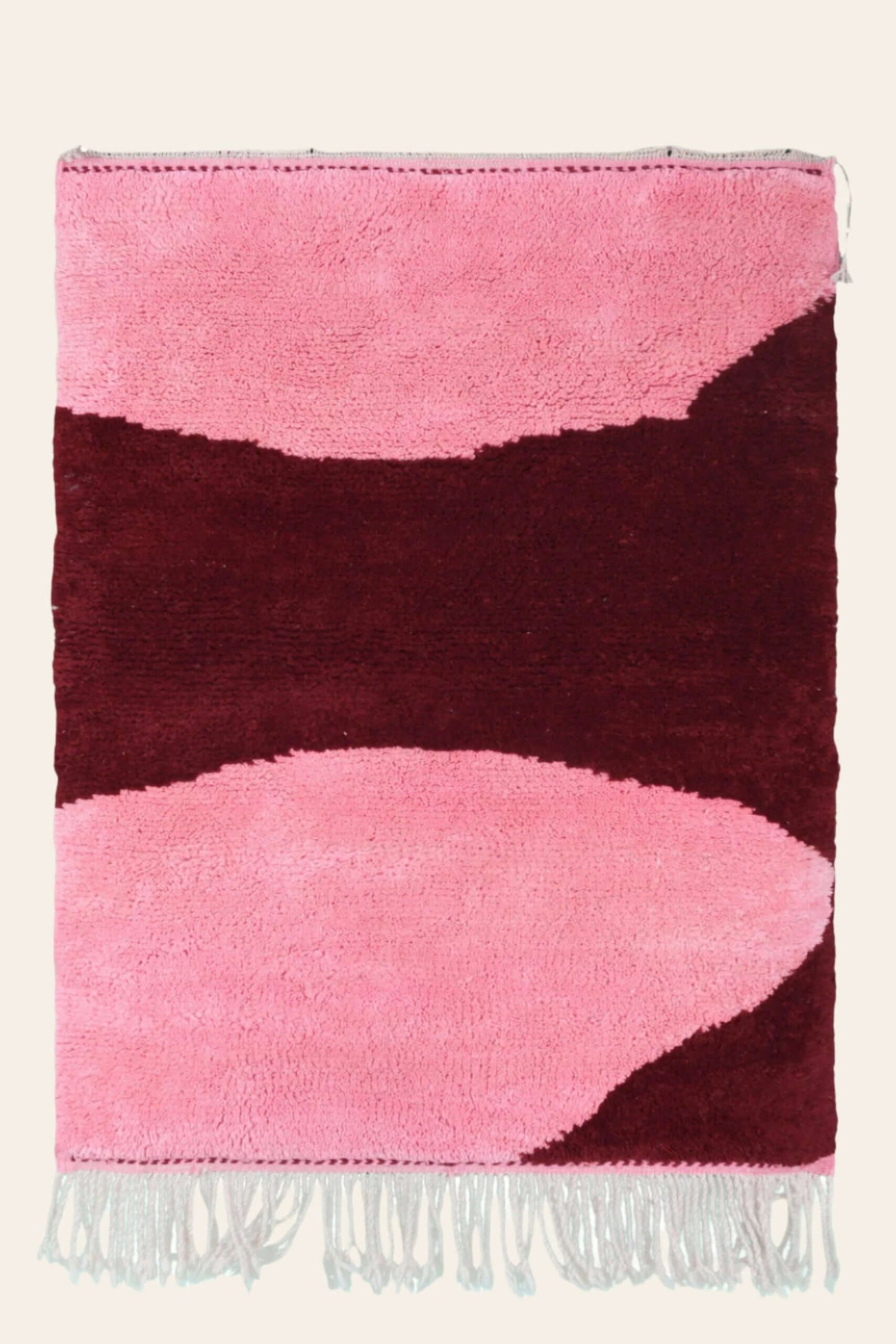 Custom Moroccan rug runner with pink and burgundy Berber Moroccan rug design, handwoven from wool, featuring fringed edges for a cozy Moroccan rug area.