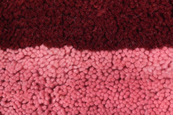 Custom Moroccan rug runner with pink and burgundy Berber Moroccan rug design, handwoven from wool, featuring fringed edges for a cozy Moroccan rug area.