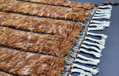 Detail of accent grid pattern on custom handmade wool rug