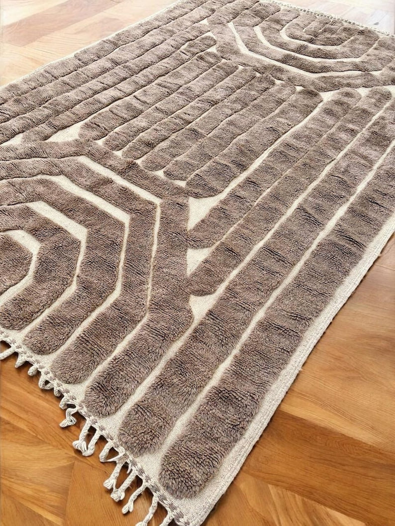 Custom Moroccan rug runner with cream base and black geometric lattice Berber Moroccan rug design, handwoven from wool, featuring fringed edges for a bold Moroccan rug area.