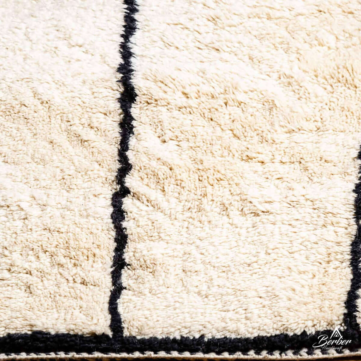 Detailed view of LineaBer rug showing soft wool texture and bold striped design