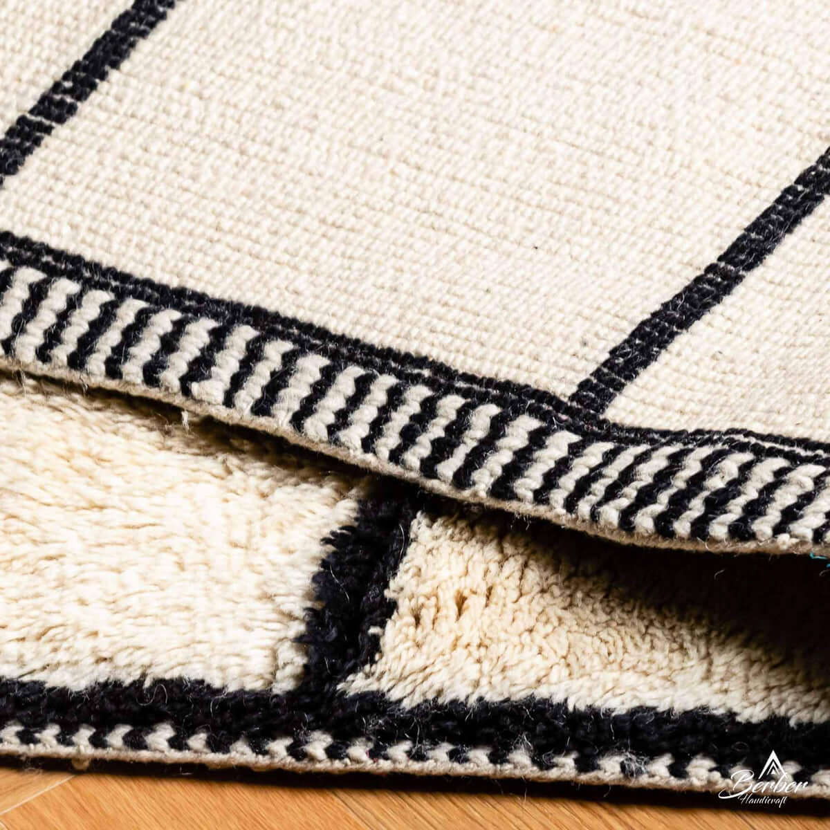 Detailed view of LineaBer rug showing soft wool texture and bold striped design