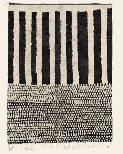 Custom Moroccan rug runner with black and white striped and dotted Berber Moroccan rug design, handwoven from wool, featuring fringed edges for a stylish Moroccan rug area.