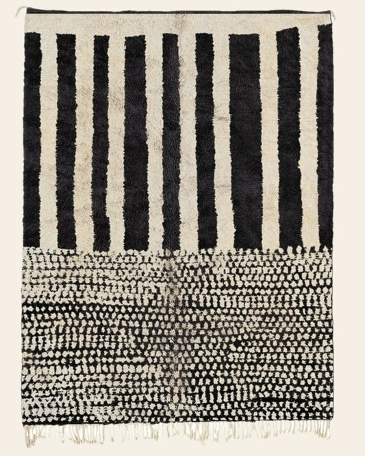 Custom Moroccan rug runner with black and white striped and dotted Berber Moroccan rug design, handwoven from wool, featuring fringed edges for a stylish Moroccan rug area.