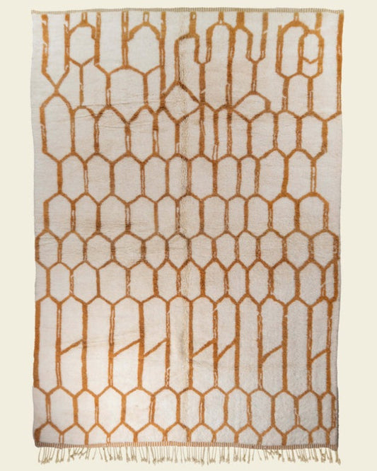 Custom Moroccan rug runner with cream base and orange hexagonal Berber Moroccan rug design, handwoven from wool, featuring fringed edges for a chic Moroccan rug area.