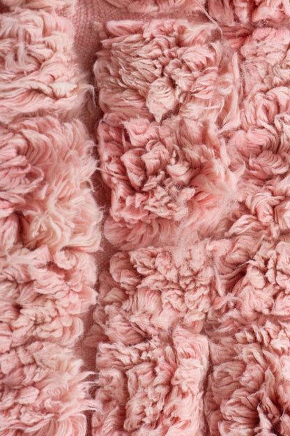 Custom Moroccan rug runner with pink and beige textured Berber Moroccan rug design, handwoven from wool, featuring fringed edges for a cozy Moroccan rug area.