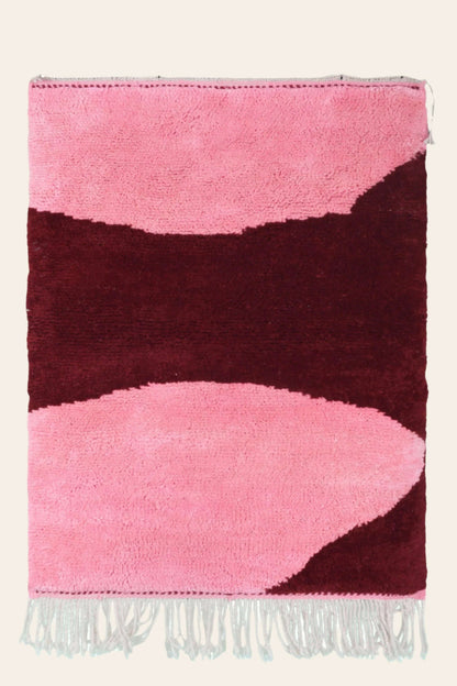 Custom Moroccan rug runner with pink and burgundy Berber Moroccan rug design, handwoven from wool, featuring fringed edges for a cozy Moroccan rug area.