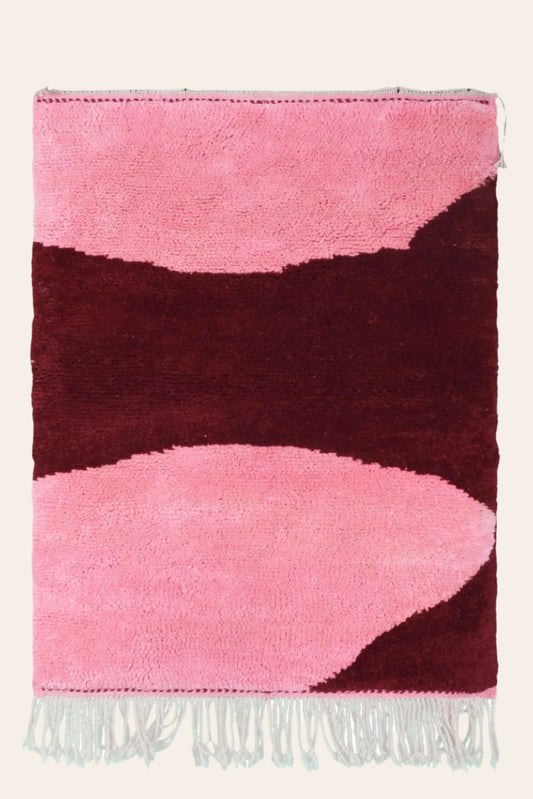Custom Moroccan rug runner with pink and burgundy Berber Moroccan rug design, handwoven from wool, featuring fringed edges for a cozy Moroccan rug area.