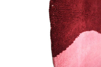 Custom Moroccan rug runner with pink and burgundy Berber Moroccan rug design, handwoven from wool, featuring fringed edges for a cozy Moroccan rug area.