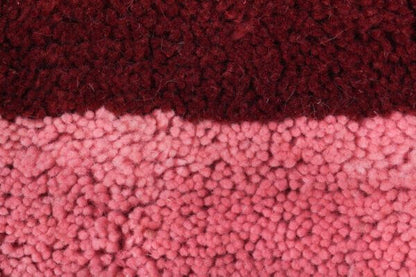 Custom Moroccan rug runner with pink and burgundy Berber Moroccan rug design, handwoven from wool, featuring fringed edges for a cozy Moroccan rug area.